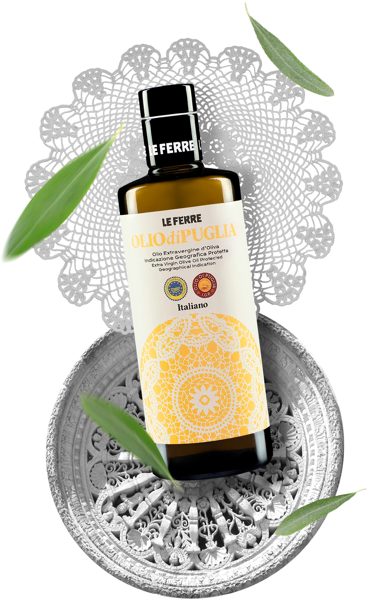 LeFerre Olio di Puglia IGP olive oil bottle with decorative yellow label on ornate silver plate, surrounded by olive leaves
